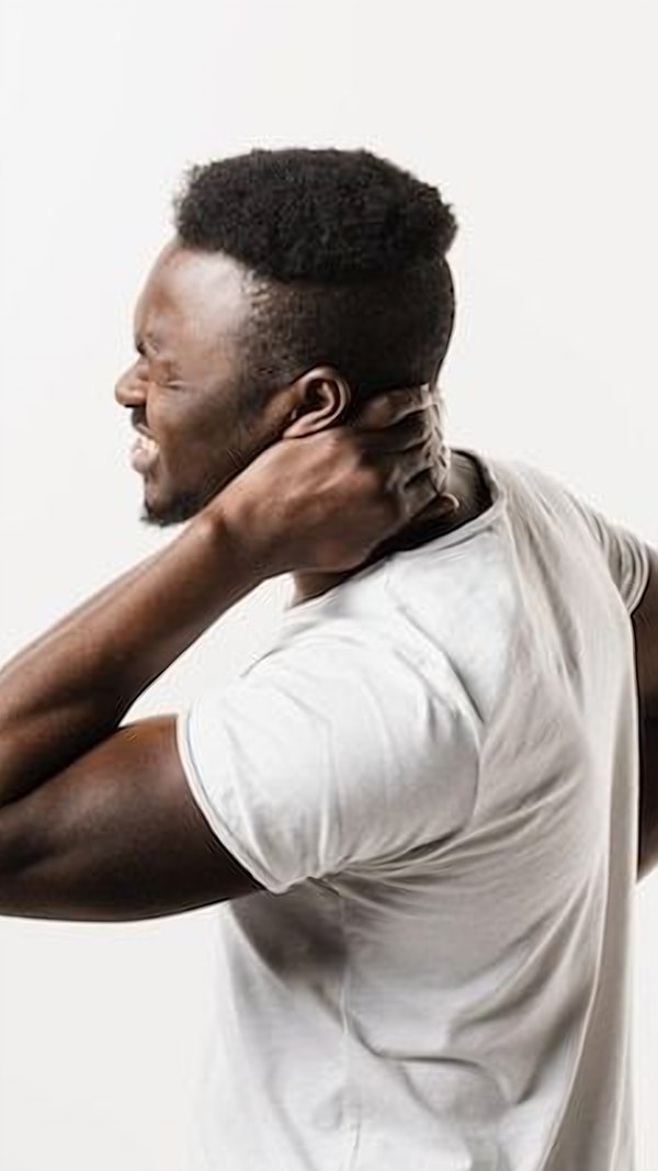 Man holding his neck in pain, representing cervical spondylosis